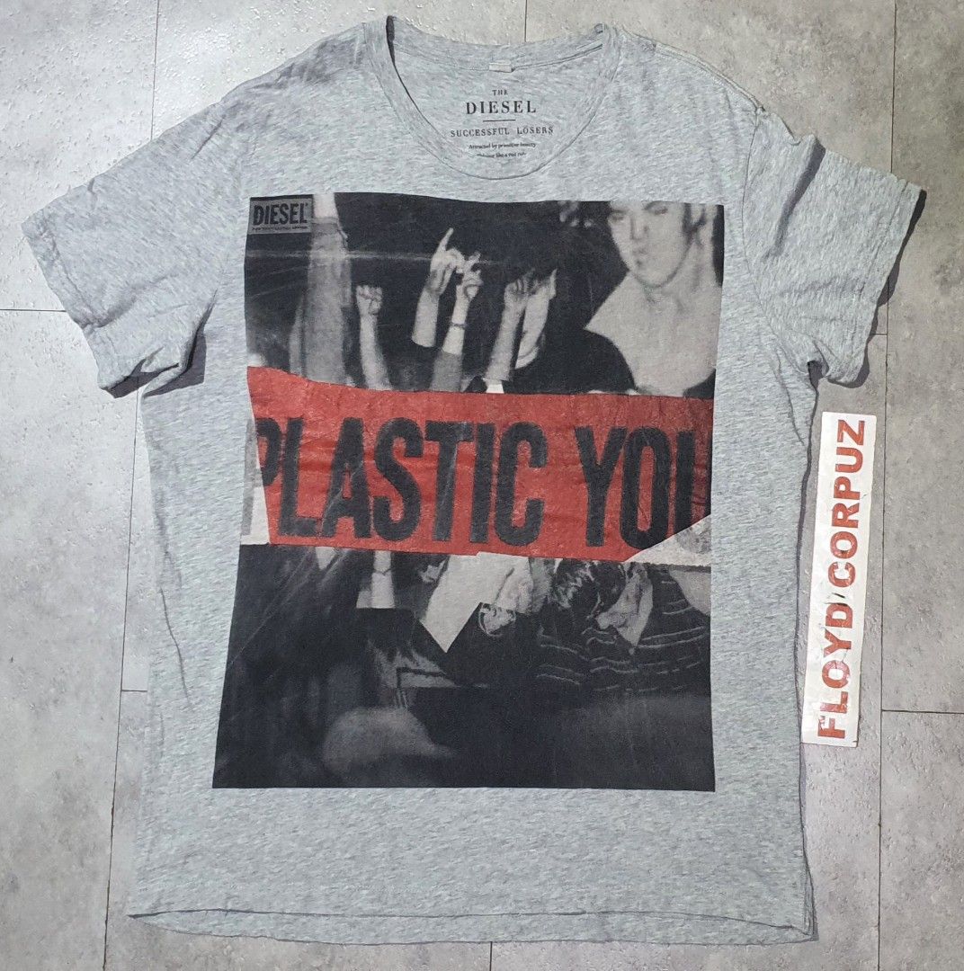 Diesel Successful Losers Graphic Tee Size M (Category: Tshirts & Polo Shirts ) located in Laoag. Submitted by floydg_corpuz22 (Listing ID 1469254623, Image 1). Description: Authentic Diesel grey short sleeve t-shirt in size medium, made from 100% cotton. Features a bold 'Plastic Youth' crowd graphic on the front and cool text print details inside the collar. Diesel Med 21.5x28 Vgood to excellent 280+sf .