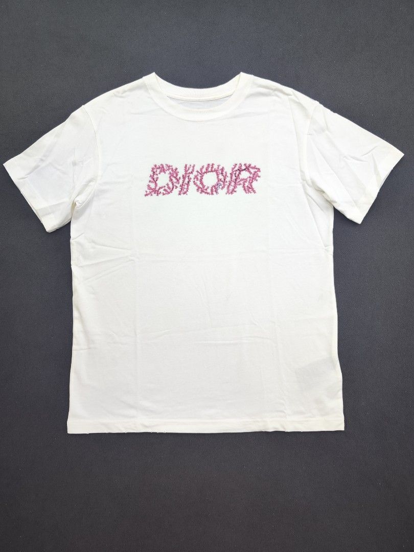 Dior Italic Coral Tee (Category: Luxury Apparel) located in Bulacan. Submitted by emilj23 (Listing ID 1469197166, Image 1). Description: Dior Italic Coral Tee Size S on tag L 27 W 20 Condition 9/10 Color rate 9/10 Issue Minimal Stains Need Wash,Cut Neck Tag.