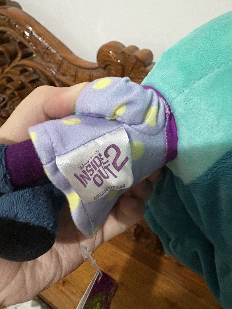 Disney Pixar Inside Out 2 Envy Plush Toy (Category: Plushies & Soft Toys) located in Quezon City. Submitted by rxyel (Listing ID 1469262591, Image 2). Description: - Official Disney Pixar merchandise from Inside Out 2 - Character: Envy with soft teal and blue hair - Wears a signature purple dress with yellow polka dots - Features large embroidered starry eyes and a sweet expression - Condition: Mint, brand new straight from the store - Includes o