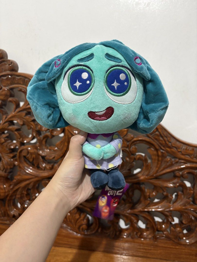 Disney Pixar Inside Out 2 Envy Plush Toy (Category: Plushies & Soft Toys) located in Quezon City. Submitted by rxyel (Listing ID 1469262591, Image 3). Description: - Official Disney Pixar merchandise from Inside Out 2 - Character: Envy with soft teal and blue hair - Wears a signature purple dress with yellow polka dots - Features large embroidered starry eyes and a sweet expression - Condition: Mint, brand new straight from the store - Includes o