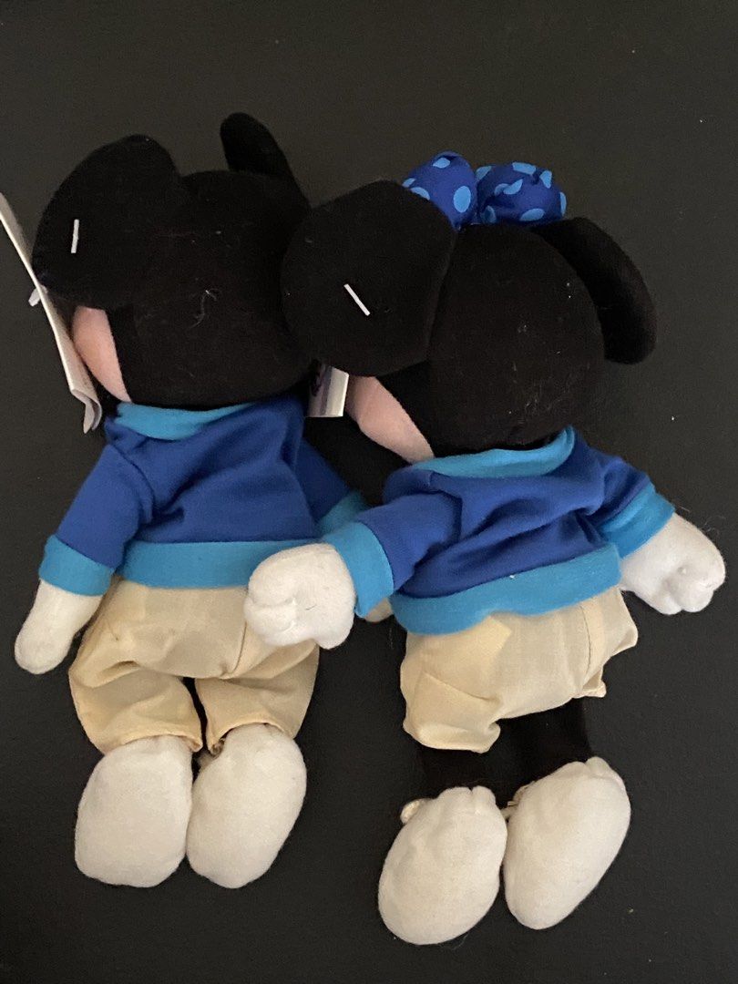Disney Store Mickey and Minnie Mouse plush set (Category: Plushies & Soft Toys) located in Davao. Submitted by hoowans_surplus (Listing ID 1469279144, Image 2). Description: - Authentic Disney Store Mickey and Minnie Mouse plush dolls - Dressed in matching blue zip-up jackets, beige pants, and white shoes - Minnie features an adorable matching blue polka dot bow - Brand new with original store tags still attached - Standard plush size, great for 
