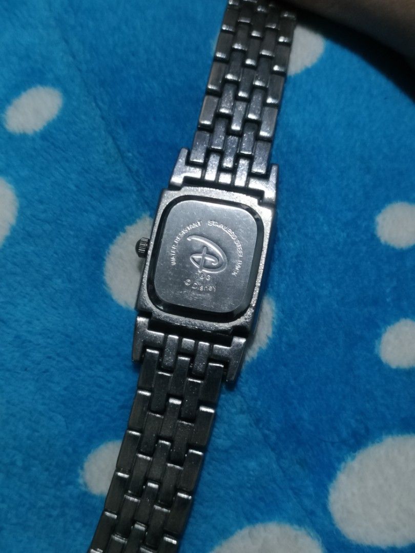 Disney Winnie the Pooh Silver Watch (Category: Women's Watches) located in Malolos. Submitted by kabanbags (Listing ID 1469185800, Image 3). Description: - Authentic Disney Winnie the Pooh collectible watch - Rectangular silver-tone dial with cute Pooh graphic - Elegant Roman numerals at 3, 6, 9, and 12 o'clock - Durable metal link bracelet with clean metallic finish - Stainless steel back case - Reliable battery-powered quartz movement - Great f