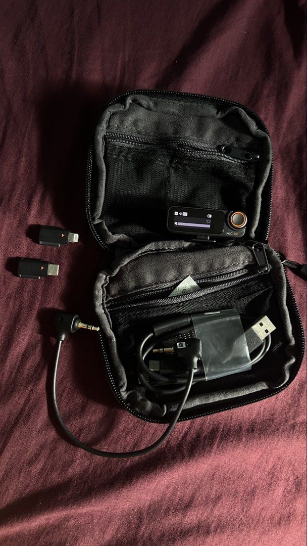 DJI Mic 2 Receiver with Adapters and Carry Case (Category: Microphones) located in Manila. Submitted by nachoman_ (Listing ID 1469222881, Image 1). Description: Authentic DJI Mic 2 receiver unit - Includes charging cable, audio cable, USB-C adapter, Lightning adapter, and original zippered pouch - Fully functional screen and smooth-turning dials - Clean ports, well-maintained and ready to use - Ideal for crystal-clear audio recording on mobile ph