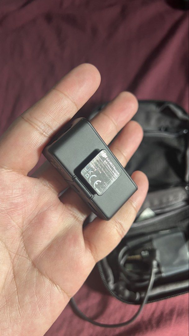DJI Mic 2 Receiver with Adapters and Carry Case (Category: Microphones) located in Manila. Submitted by nachoman_ (Listing ID 1469222881, Image 2). Description: Authentic DJI Mic 2 receiver unit - Includes charging cable, audio cable, USB-C adapter, Lightning adapter, and original zippered pouch - Fully functional screen and smooth-turning dials - Clean ports, well-maintained and ready to use - Ideal for crystal-clear audio recording on mobile ph