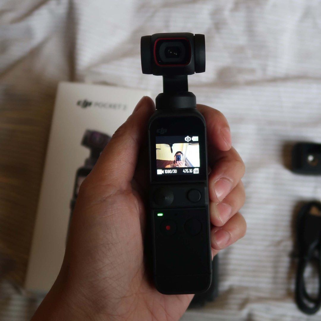 DJI Pocket 2 Camera (Category: Video Cameras) located in Manila. Submitted by gentlewind_62f064 (Listing ID 1469260446, Image 3). Description: - DJI Pocket 2 pocket-sized 4K gimbal camera - Pristine lens and smooth gimbal mechanism - Includes original box, protective cover, charging cable, and mounting base - Perfect for vloggers and content creators on the go.