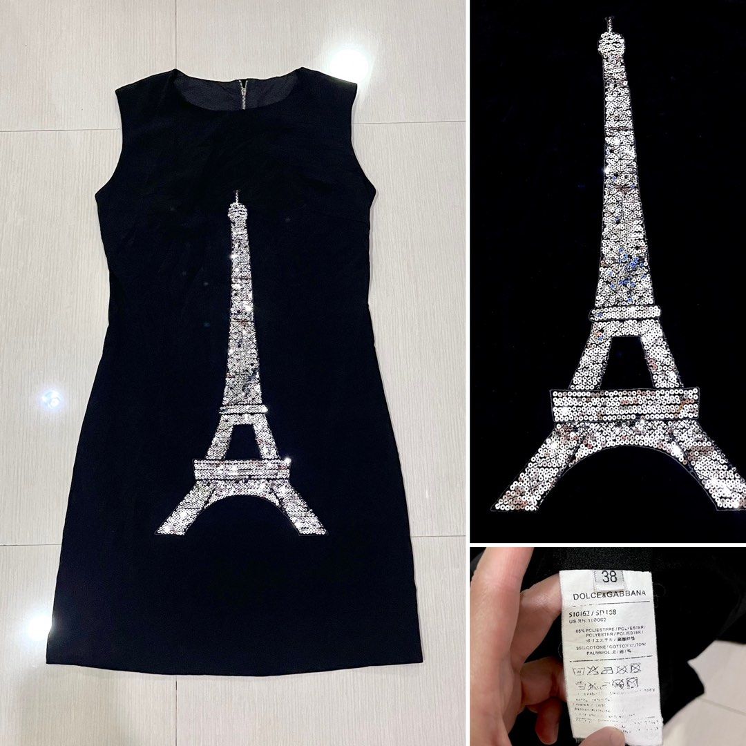 Dolce & Gabbana Eiffel Tower Sequin Black Dress (Category: Dresses) located in Amlan (Ayuquitan). Submitted by pringpring (Listing ID 1469164437, Image 2). Description: - Brand: Dolce & Gabbana - Style: Sleeveless shift dress with exposed back zipper - Design: Sparkly sequin Eiffel Tower patch on the front - Size: 38 - Material: 65% polyester, 35% cotton.