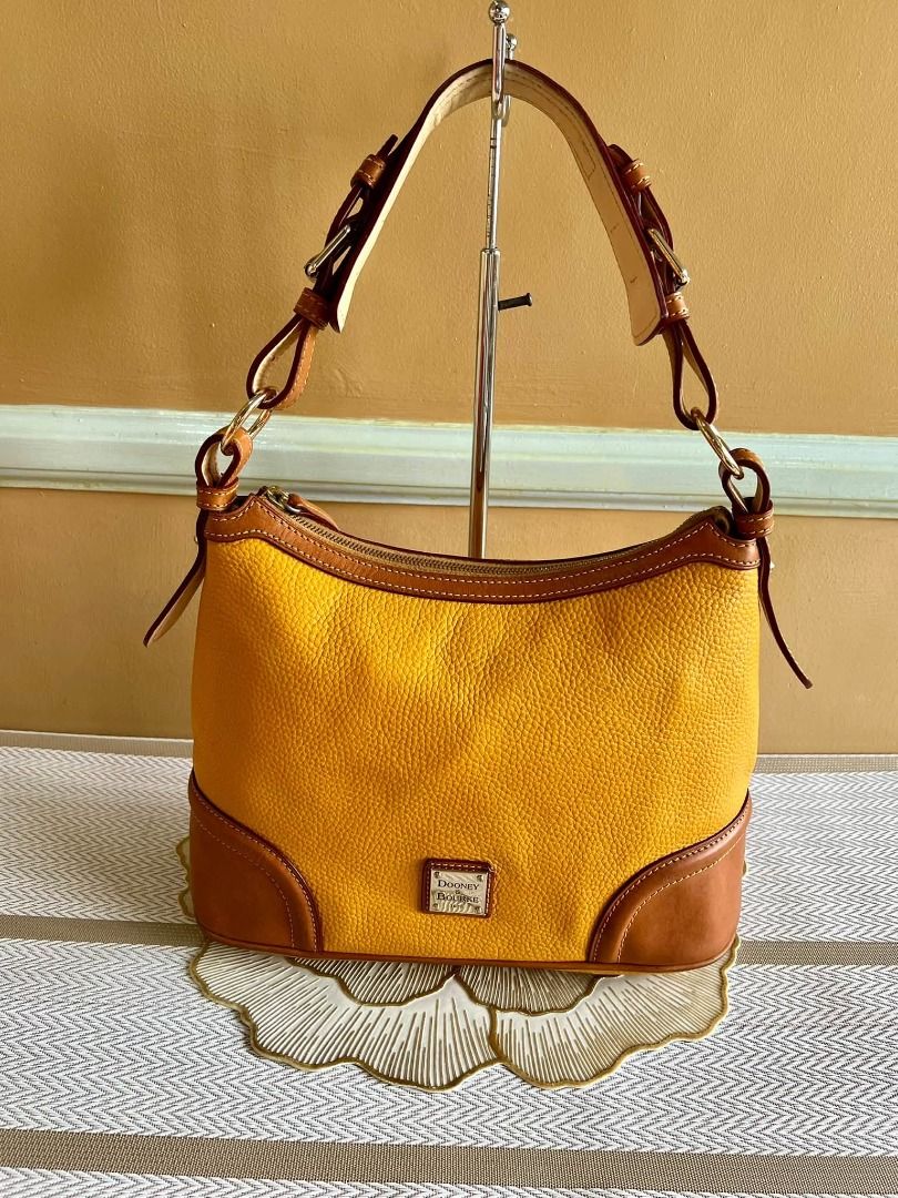 Dooney & Bourke Brand Shoulder or Hand Bag (Category: Luxury Bags & Wallets) located in Quezon City. Submitted by bellafashion08 (Listing ID 1469182532, Image 3). Description: Dimension: - Height = 9 in. - Length = 11 in. * From U.S * Nice in actual .