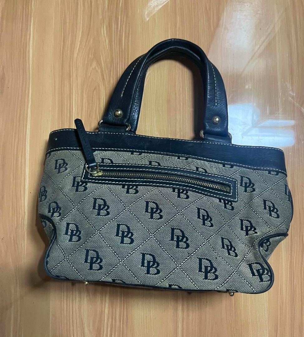 Dooney & Bourke Monogram Canvas Handbag (Category: Tote Bags) located in Manila. Submitted by senggggg. (Listing ID 1469193167, Image 3). Description: good condition working zip minimal sign of use.