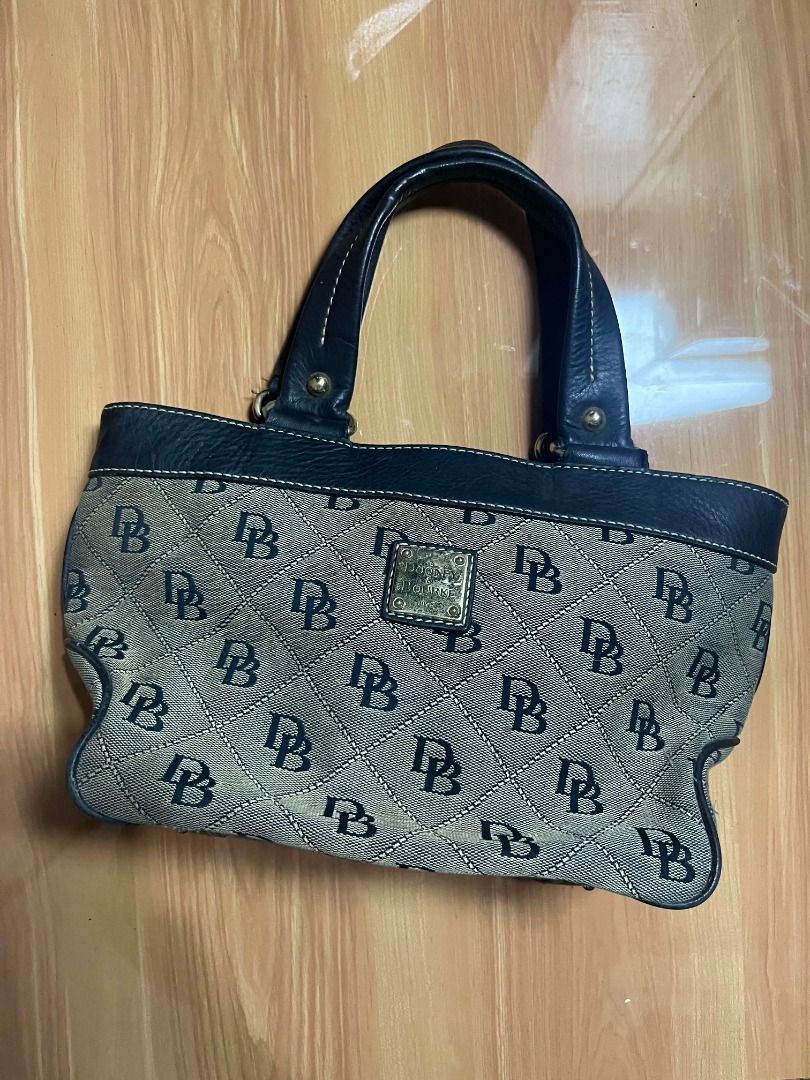 Dooney & Bourke Monogram Canvas Handbag (Category: Tote Bags) located in Manila. Submitted by senggggg. (Listing ID 1469193167, Image 2). Description: good condition working zip minimal sign of use.