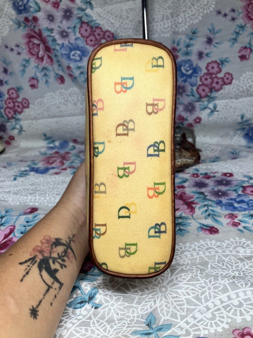 DOONEY & BOURKE RAINBOW MONOGRAM DOOMED COSTEMIC POUCH (Category: Purses & Pouches) located in General Mariano Alvarez. Submitted by adonid (Listing ID 1469179309, Image 3). Description: DOONEY & BOURKE RAINBOW MONOGRAM DOOMED COSTEMIC POUCH GOOD CONDITION NORMAL SIGN OF USAGE ONLY.