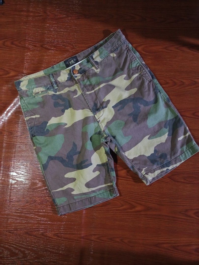 DOUBLE RL RALPH LAUREN CAMO SHORTS (Category: Shorts) located in Quezon City. Submitted by unholy_finds (Listing ID 1469288944, Image 3). Description: - Brand: RRL Ralph Lauren - Item: Camouflage Shorts - Size: 33 - Material: 100% heavyweight cotton - Features: Button fly closure, 2 front pockets, 2 buttoned back pockets - Details: Iconic Double RL label on rear pocket - Origin: Made in China - Condition: Good pre-owned condition with classic mil