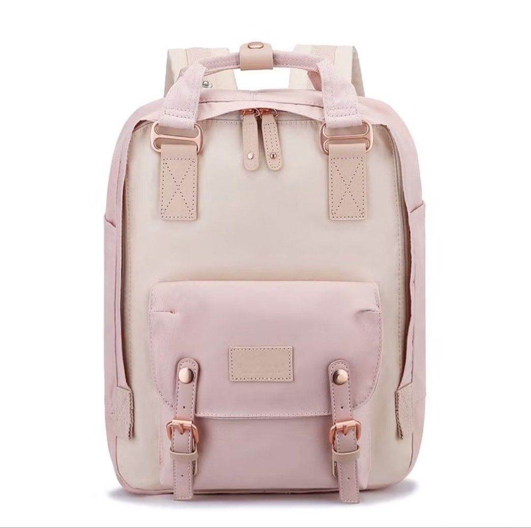 Doughnut Macaroon Backpack Pastel Pink Cream (Category: Backpacks) located in Quezon City. Submitted by temssoleil (Listing ID 1469315344, Image 1). Description: - Brand: Doughnut Macaroon - Used thrice only, there's a little scratch of pen but it can be erased - Colorway: Pastel pink and cream with rose gold hardware - Features: Front pouch pocket with buckle closures, brand patch, adjustable shoulder straps, and top grab handles with snap butto