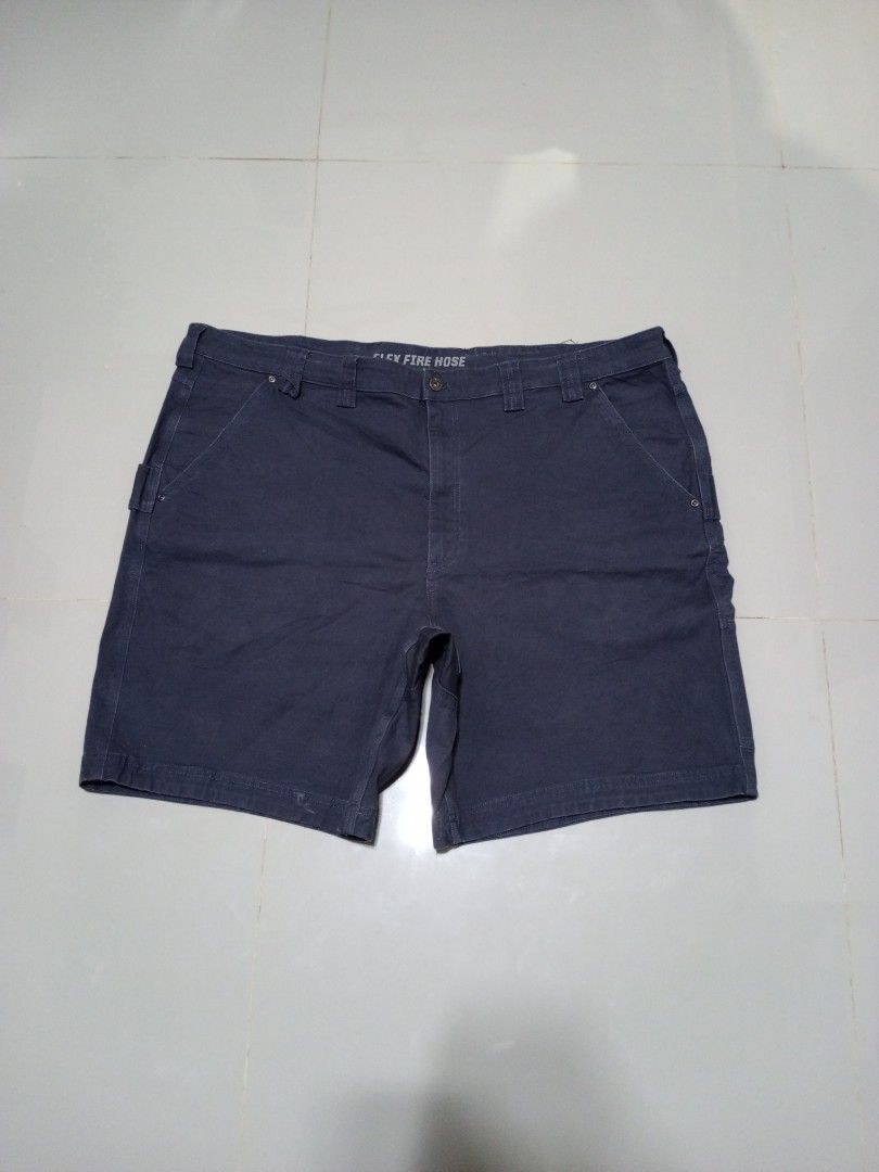 Duluth Trading Carpenter Flex Fire Hose Shorts Size 48 (Category: Shorts) located in Magdalena. Submitted by magdalenathrift20 (Listing ID 1469168866, Image 2). Description: - Brand: Duluth Trading Co. - Style: Fire Hose Carpenter Shorts - Color: Navy Blue - Size: 48 Waist / 22 Length - Material: 97% Cotton, 3% Spandex (tough yet stretchy) - Features: Multiple utility pockets and tool loops - Condition: Heavy-duty workwear, built to last - Origin