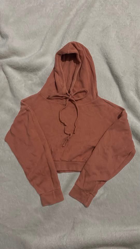Dusty Pink Crop Hoodie with Drawstrings (Category: Coats, Jackets and Outerwear) located in Manila. Submitted by nobleowl-8fff (Listing ID 1469287593, Image 1). Description: - Color: Dusty pink - Style: Cropped hoodie with long sleeves and ribbed cuffs - Details: Adjustable drawstrings at the hood - Material: Soft fleece lining inside - Fit: Great length for high-waisted jeans or sweatpants - Condition: Clean and well-maintained - Perfect for: Ev