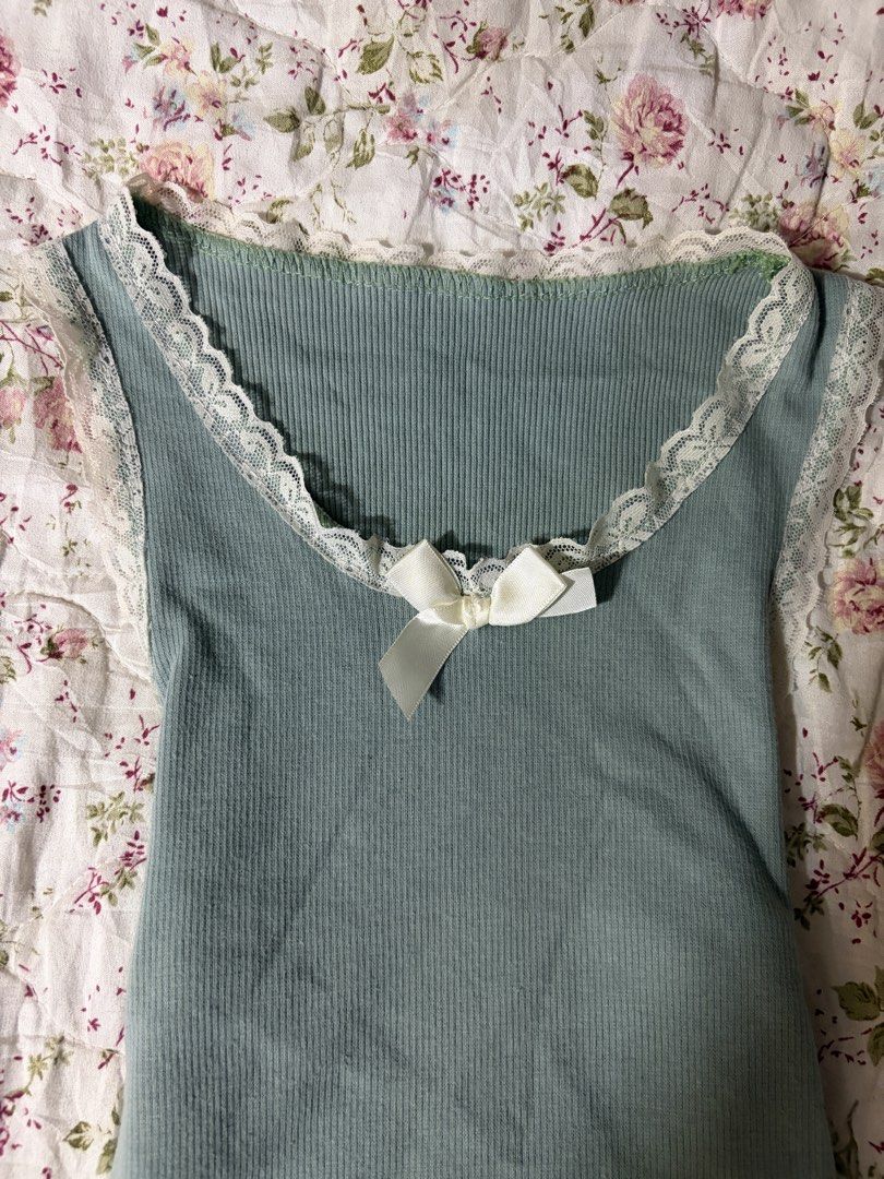 Dusty Teal Lace Bow Cami Top (Category: Sleeveless) located in Muntinlupa City. Submitted by herellas0504 (Listing ID 1469300147, Image 3). Description: Dusty Teal Lace Bow Cami Top Mine: 150 | Lock: 200 ———————————— size: xs-med no issue.