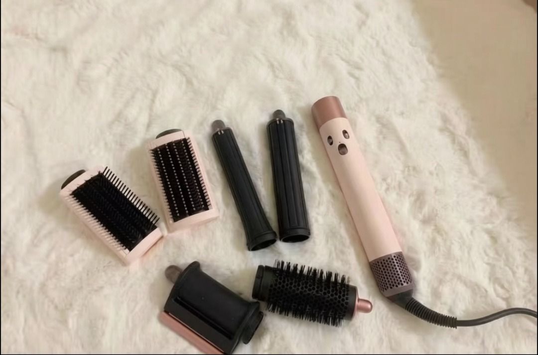 Dyson Airwrap Multi-Styler Complete (Category: Hair) located in Las Pinas. Submitted by zenriver-b433df (Listing ID 1469219380, Image 1). Description: - Authentic Dyson Airwrap Multi-styler - Limited Ceramic Pop and Rose Gold colorway - Includes main wand unit and all essential attachments (barrel curlers, smoothing brushes, round volumizing brush) - Fully functional buttons and speed controls - Perfect for salon-quality styling right at home - W