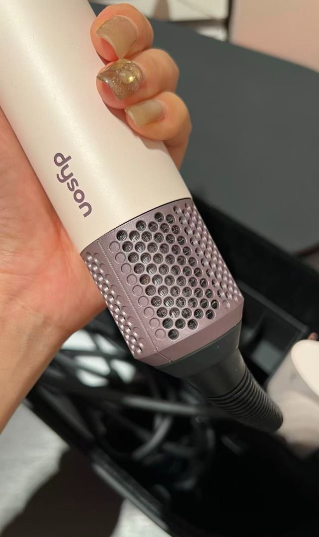 Dyson Airwrap Multi-Styler Complete (Category: Hair) located in Las Pinas. Submitted by zenriver-b433df (Listing ID 1469219380, Image 2). Description: - Authentic Dyson Airwrap Multi-styler - Limited Ceramic Pop and Rose Gold colorway - Includes main wand unit and all essential attachments (barrel curlers, smoothing brushes, round volumizing brush) - Fully functional buttons and speed controls - Perfect for salon-quality styling right at home - W