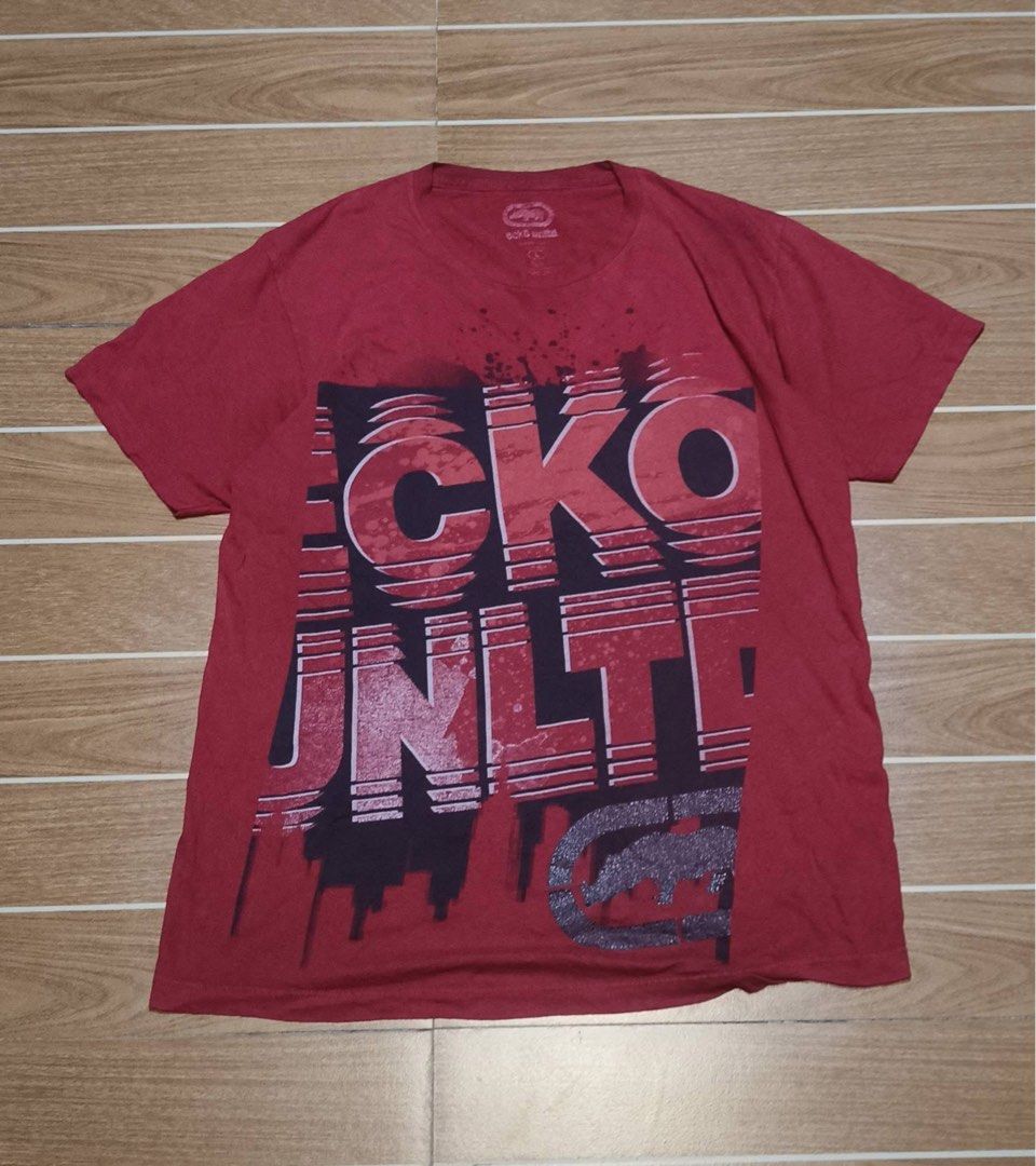 Ecko Unltd Red Graphic T-shirt (Category: Tshirts & Polo Shirts ) located in Manila. Submitted by wanluis (Listing ID 1469216914, Image 1). Description: - Brand: Ecko Unltd. - Color: Vibrant Red - Size: Large - Design: Large block print on front with iconic rhino logo near hem - Fit/Style: Short sleeves, standard crew neck, casual streetwear - Condition: Clean fabric, clear branding tag on inside collar.