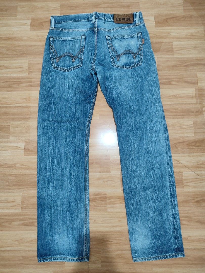 Edwin New Vintage Selvedge (Category: Jeans) located in Lipa City. Submitted by gudoys_outdoor16 (Listing ID 1469287843, Image 2). Description: - Brand/Model: Edwin New Vintage 503V - Origin: Made in Japan - Size: 34 Waist length 42.2 - Wash: Medium blue with factory whiskering and fading - Details: Heavy denim weight, classic 5-pocket style, button fly, leather back patch - Condition: Clean construction, excellent quality 1300 + sf Only.