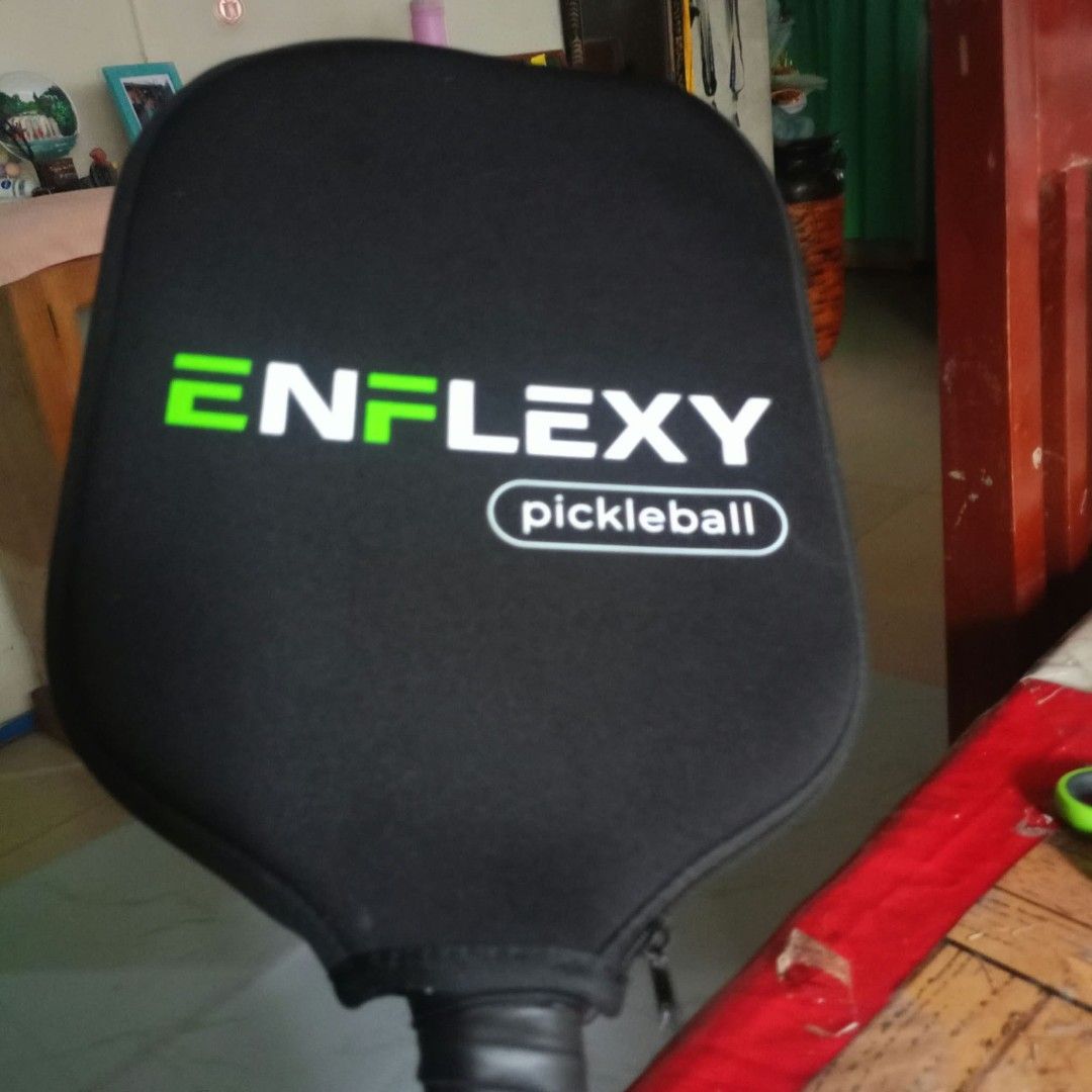 Enflexy Noir Prime X1 16mm Pickleball Paddle (Category: Racket and Ball Sports) located in Davao. Submitted by katy.tx (Listing ID 1469373313, Image 3). Description: - Model: Enflexy Noir Prime X1 Pickleball Paddle - Colorway: Red and black edge guard - Thickness: 16mm for optimal control and power - Surface: T700 carbon fiber for superior spin - Core: Foam core construction - Certification: USA Pickleball (USAPA) approved - Inclusions: Original 