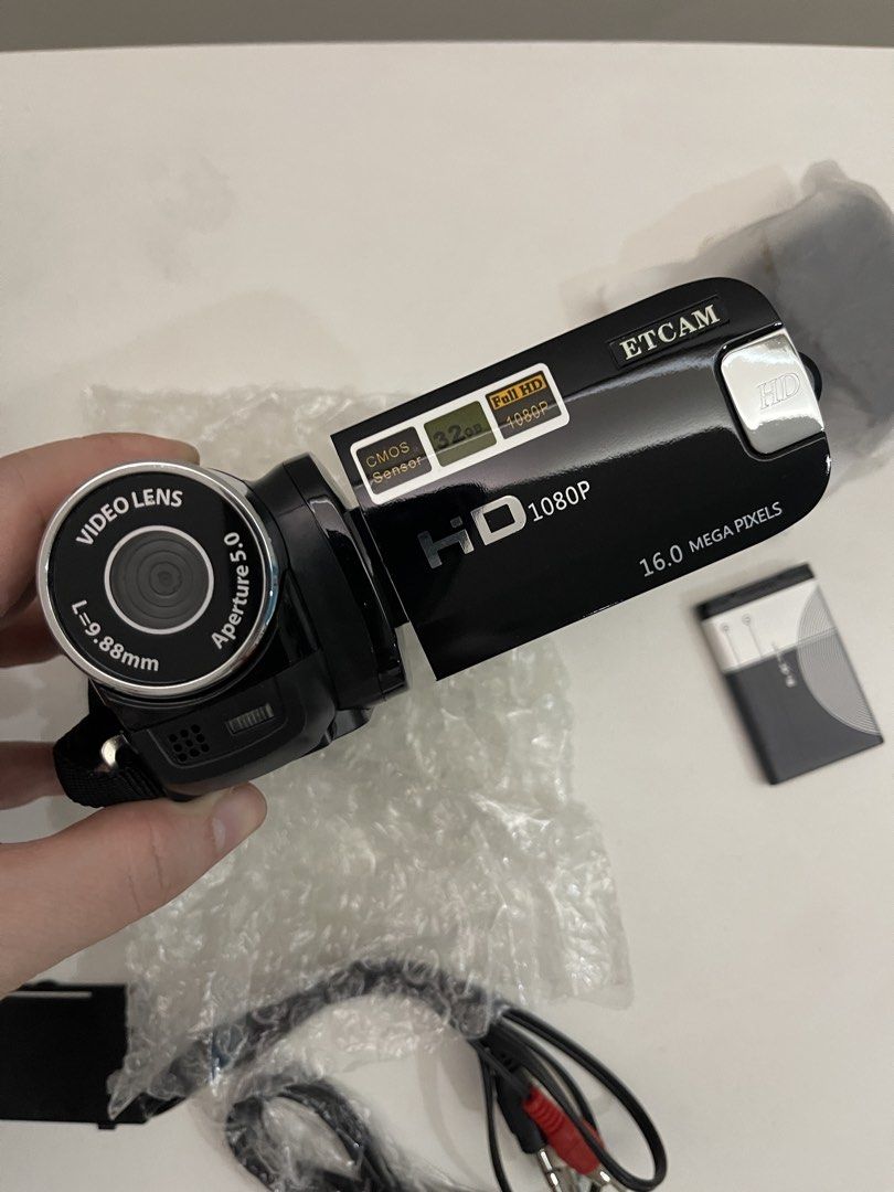 ETCAM HD 1080P Digital Video Camera Recorder (Category: Cameras) located in Pasig City. Submitted by altopentle (Listing ID 1469210544, Image 3). Description: - Brand: ETCAM HD 1080P Digital Video Camera Recorder - Condition: Like new (unpacked for photos only) - Color: Sleek black finish with attached hand strap and swivel screen - Resolution: Full HD 1080P video recording with 16.0 Megapixels - Zoom: 16X digital zoom - Inclusions: Original box,