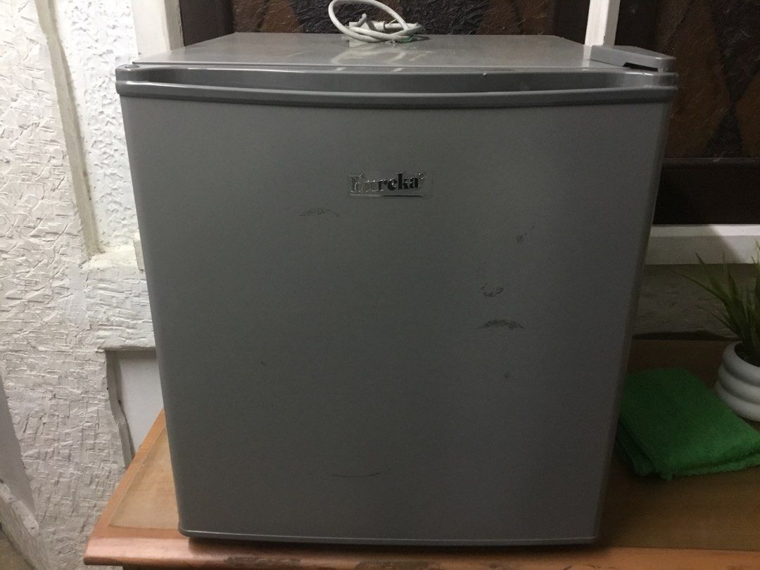 Eureka Mini Refrigerator Grey Single Door (Category: Refrigerators and Freezers) located in Manila. Submitted by roberto.enriquez (Listing ID 1469366005, Image 2). Description: - Brand/Model: Eureka mini fridge in grey - Design: Single door with interior shelf and door compartments - Performance: Powers on with standard plug, runs quietly with a 0-7 temperature dial - Ideal For: Dorm rooms, offices, or small bedrooms - Condition: Exterior has scu
