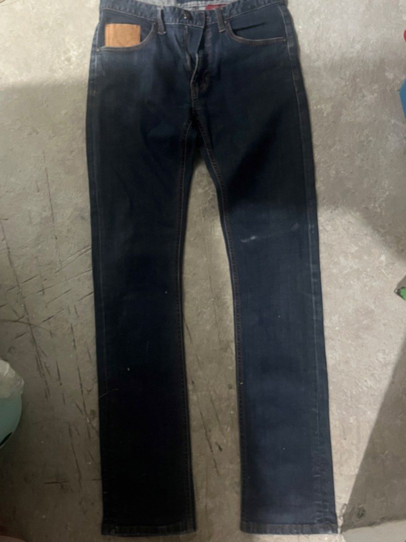 Evisu Beyond The Denim Slim Straight Jeans (Category: Jeans) located in Manila. Submitted by brightriver-55c3 (Listing ID 1469298152, Image 1). Description: - Brand: Evisu - Fit: Slim straight - Color/Wash: Dark wash denim - Details: Yellow 'Beyond The Denim' embroidery on the back - Waistband: Distinct leather patch with metal logo hardware - Closure: Branded button fly - Interior: Red pocket lining - Pockets: Rear welt pockets with contrast tri