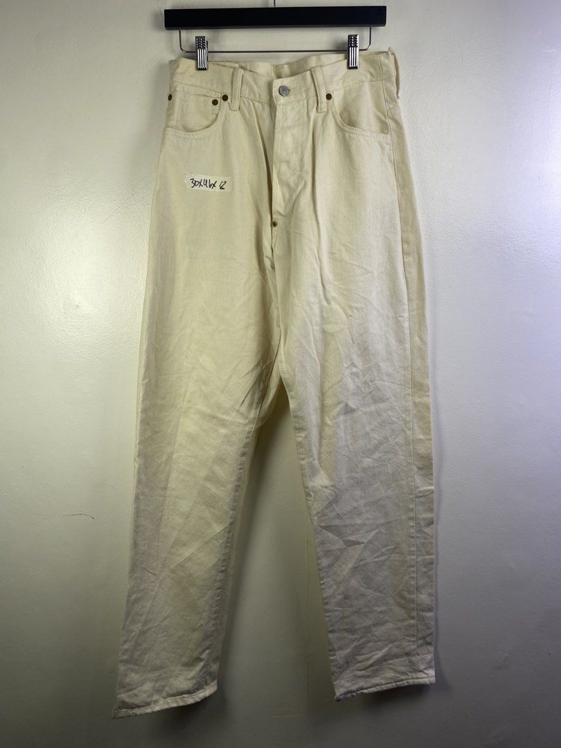 Evisu White Cotton Jeans Size 36 (Category: Jeans) located in Manila. Submitted by declutterpromax (Listing ID 1469201985, Image 1). Description: - Material: 100% cotton white denim - Size: 36 (inner waistband tag) - Fit: Straight leg style - Details: Unique curved back pockets, branded buttons, and thick contrast stitching - Condition: Pre-owned/storage item with some minor yellowing and spots.