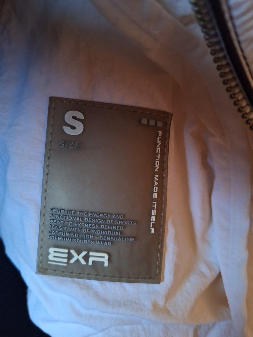 EXR White Sporty Jacket Size S (Category: Coats, Jackets and Outerwear) located in Balamban. Submitted by ubethan (Listing ID 1469231050, Image 2). Description: - Size: Small (S) - Style: Streetwear racing jacket - Material: Lightweight nylon body with breathable mesh side panels - Design: Full zip front, stand collar, and eye-catching checkered and colorful striped sleeves - Details: Embroidered 'progressive' chest patches and embossed wording o