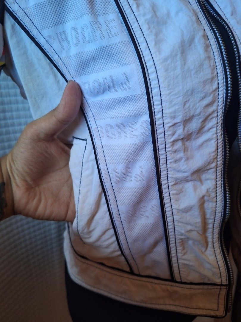 EXR White Sporty Jacket Size S (Category: Coats, Jackets and Outerwear) located in Balamban. Submitted by ubethan (Listing ID 1469231050, Image 3). Description: - Size: Small (S) - Style: Streetwear racing jacket - Material: Lightweight nylon body with breathable mesh side panels - Design: Full zip front, stand collar, and eye-catching checkered and colorful striped sleeves - Details: Embroidered 'progressive' chest patches and embossed wording o