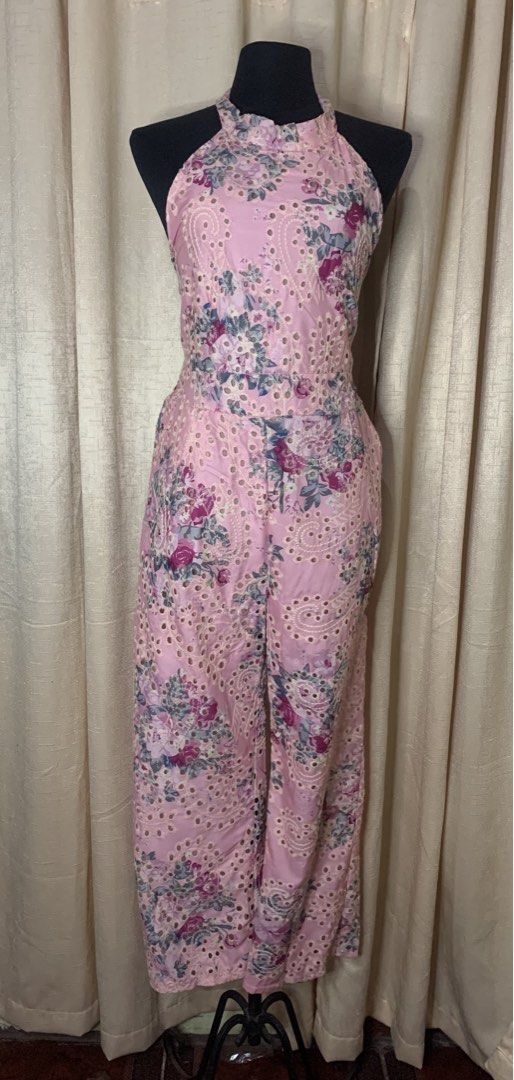 Eyelet Halter Jumpsuit with side pockets (Category: Jumpsuits) located in Cainta. Submitted by vestito_bestida (Listing ID 1469292802, Image 3). Description: ⛔️ACTUAL PHOTO POSTED⛔️ 👉 Brandnew Eyelet Halter Jumpsuit with side pockets 👉 Color: Floral Pink 👉 Length: 50" 👉 Waist: 26" to 32" 👉 Condition: Brand new with tag attached 👉 Design: Pink halter jumpsuit with eyelet floral pattern and adjustable neck ties 👉 Fit & Comfort: Smocked elast