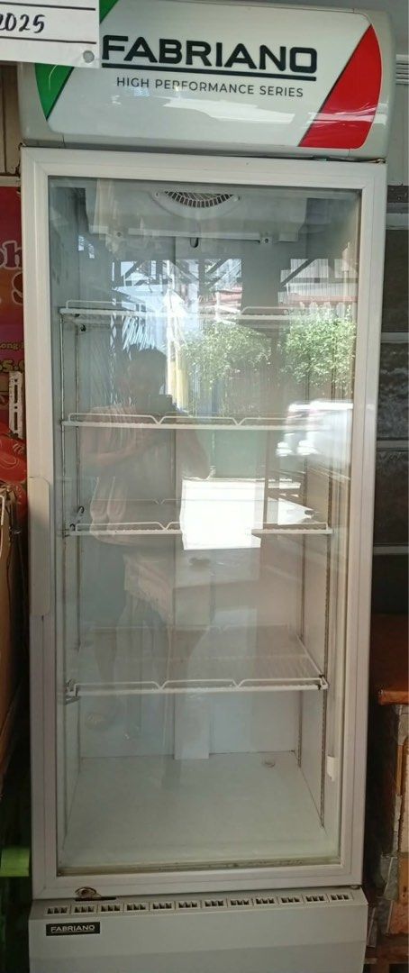 Fabriano High Performance Series Glass Door Display Fridge (Category: Refrigerators and Freezers) located in Manila. Submitted by camzcastro70875 (Listing ID 1469173505, Image 1). Description: - Brand: Fabriano High-Performance Series Display Chiller - Design: Upright single glass door with clean white frame finish - Interior: Top lighting with 4 adjustable wire shelves - Performance: Solid commercial unit that keeps drinks ice cold - Condition: 