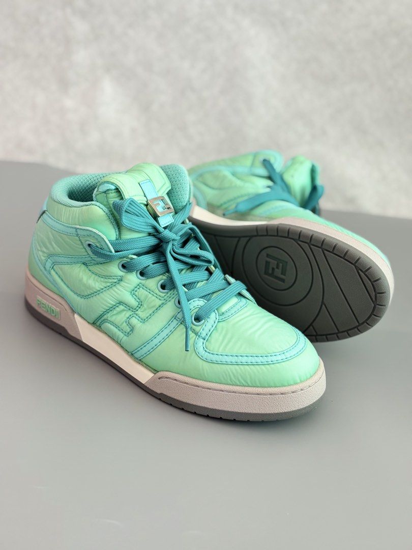 Fendi Match High Top Sneakers (Category: Sneakers & Footwear) located in Muntinlupa City. Submitted by ironman0907 (Listing ID 1469169386, Image 1). Description: Fendi Match Nylon Turquoise High-Top Sneakers – Special 25th Anniversary Edition A rare and distinctive Fendi Match high-top sneaker in a vibrant turquoise colorway, released as a special edition commemorating the brand’s 25th anniversary. Product Details: * Brand: Fendi * Model: Match H