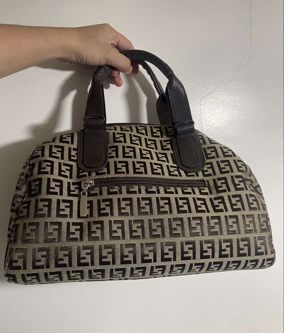 Fendi Monogram Shoulder Bag (Category: Luxury Bags & Wallets) located in Davao. Submitted by newowl_777 (Listing ID 1469284910, Image 2). Description: - Fendi monogram canvas in brown and beige - Double dark brown leather carry handles with silver hardware - Exterior side zip pocket with silver pull tab - Fully lined black fabric interior with extra slip pockets - Condition: Excellent / Well-maintained .