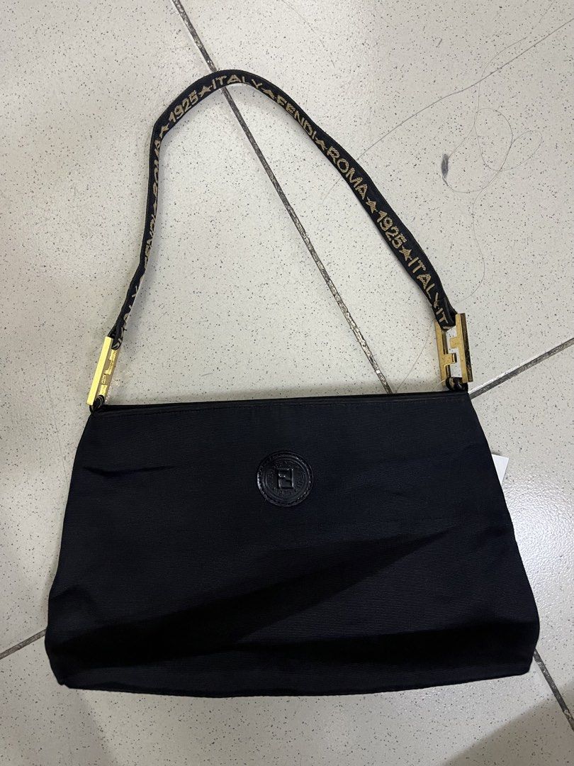 FENDI ROMA 1925 ITALY (Category: Luxury Bags & Wallets) located in Manila. Submitted by hello_juicyyyy (Listing ID 1469383027, Image 1). Description: vintage Fendi black nylon shoulder bag featuring a jacquard logo strap that reads “FENDI ROMA 1925 ITALY” and a circular FF logo medallion on the front. 11 x 7 .