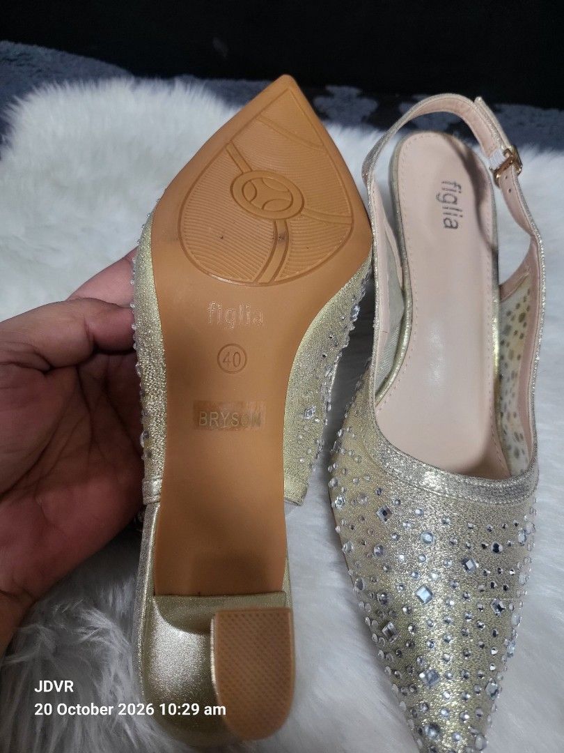 Figlia Gold Rhinestone Slingback Heels Size 40 (Category: Heels) located in Pasig City. Submitted by iba_by_jane (Listing ID 1469176825, Image 2). Description: - Brand/Model: Figlia Gold Slingback Heels - Size: 40 (marked on sole) - Color/Design: Gold with rhinestone-embellished pointed toe and polka dot mesh side panels - Heel Type: Low flared heels for comfortable wear - Features: Adjustable buckle strap at the back, light beige inner lining wi