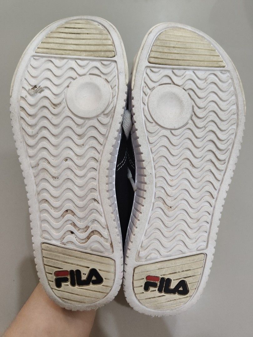FILA Black Canvas Platform Sneakers (Category: Sneakers) located in Calamba. Submitted by an_ne0501 (Listing ID 1469210867, Image 2). Description: - Brand: FILA - Size : EU 36.5 - Style: Black canvas sneakers with chunky white platform soles - Details: White laces, contrast stitching, and durable rubber toe caps - Branding: FILA logo on the heel outsoles - Condition: Pre-owned with light dirt marks on the soles - Fit: Comfortable for everyday wea