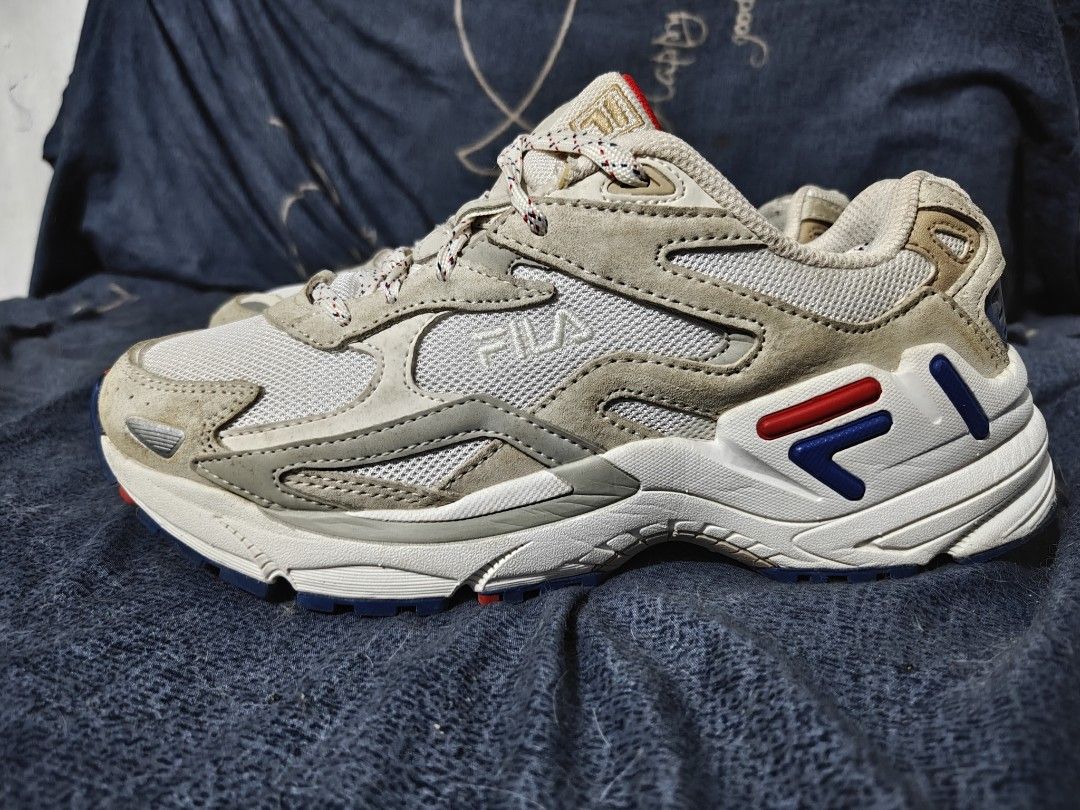 Fila Chunky Sneakers Size US 6.5 (Category: Sneakers) located in Manila. Submitted by mysticocean-5bcd (Listing ID 1469166828, Image 2). Description: - Brand/Model: Fila chunky sneakers - Colorway: Cream, blue, and red with a red inner lining - Materials: Layered upper with breathable mesh panels and premium suede overlays - Features: Patterned laces and a rugged rubber outsole with excellent grip - Size: US 6.5 / EUR 39 / UK 5.5 - Condition: Cle