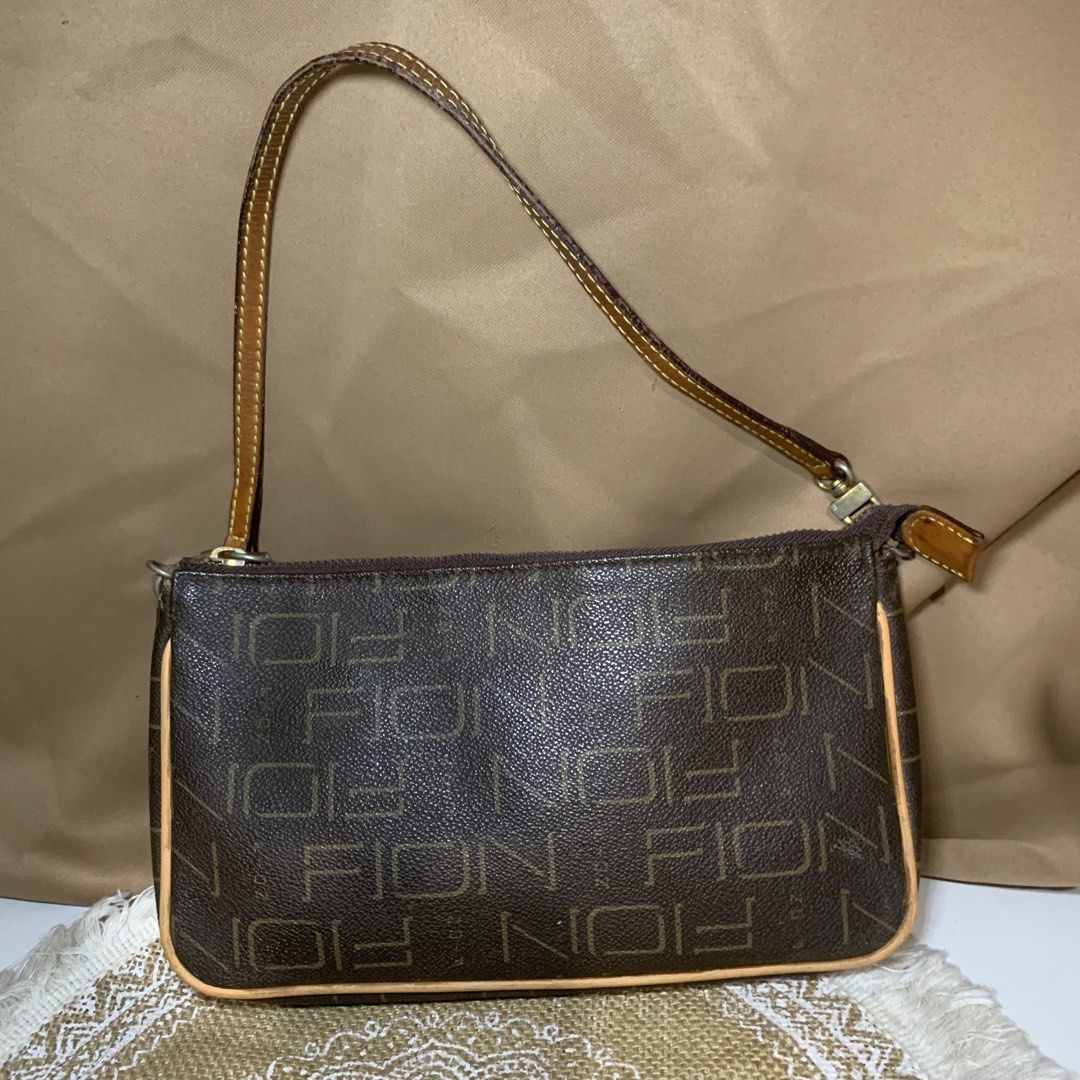 FION Monogram Brown Shoulder Bag (Category: Luxury Bags & Wallets) located in Mandaluyong City. Submitted by gentle.segoviajam (Listing ID 1469322996, Image 1). Description: Authentic FION brown monogram shoulder bag with tan leather trim. Features a secure zip top, fabric-lined interior with pockets, and minor hardware tarnishing. Perfect everyday compact bag!.