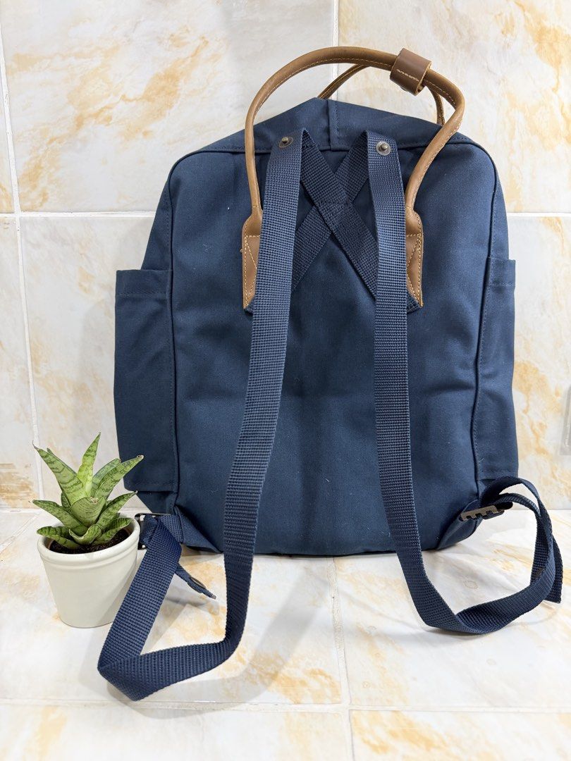 Fjallraven Kanken No.2 Backpack Dark Navy (Category: Backpacks) located in Manila. Submitted by haveago0dthrift (Listing ID 1469281919, Image 3). Description: - Model: Fjällräven Kånken No. 2 - Color: Dark Navy Blue with Brown Leather handles and details - Material: Highly durable G-1000 HeavyDuty - Compartments: Classic zipped front pocket and two side pockets - Condition: Interior name label and wash care tag fully intact - Features: Adjustable