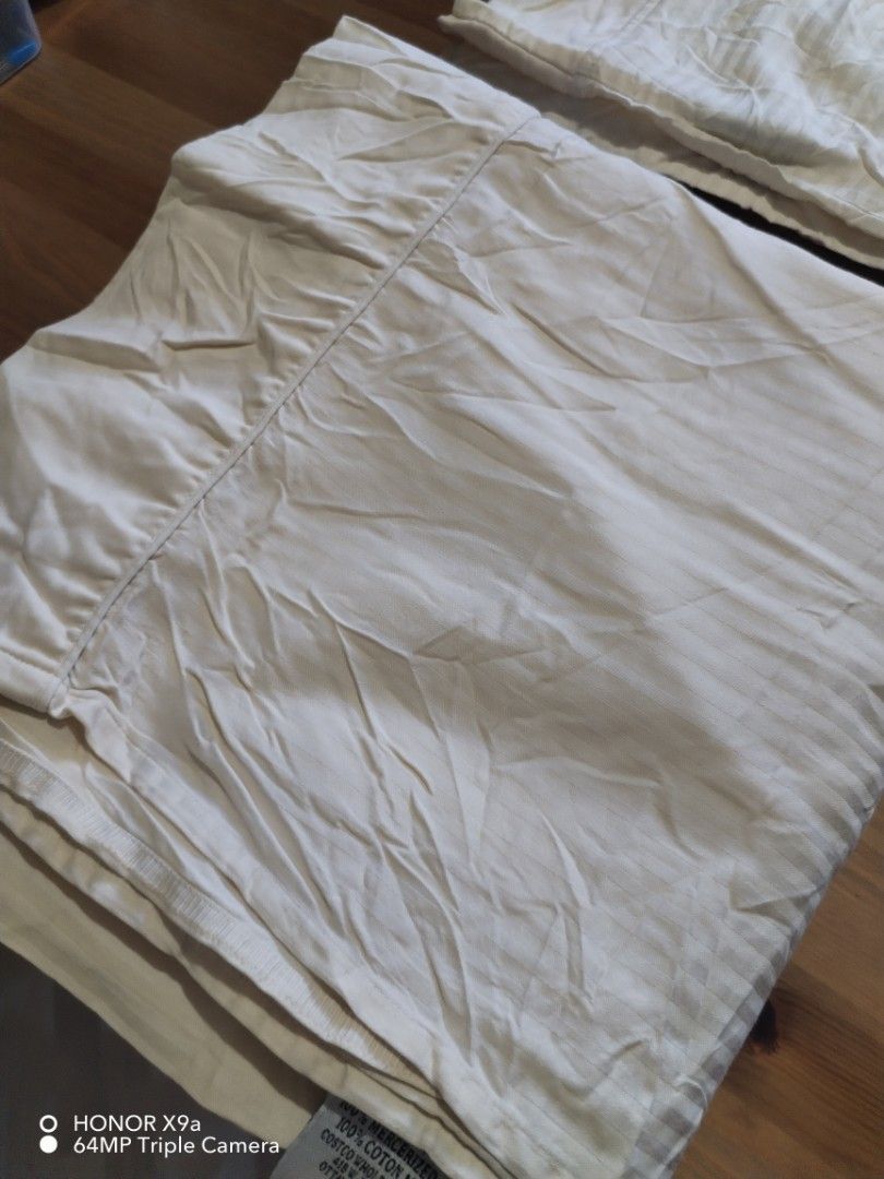 Flatsheet & Pillow case ( King size) (Category: Bedding & Towels) located in Muntinlupa City. Submitted by arciagamaryann68 (Listing ID 1469217934, Image 2). Description: - Product: Flatsheet & Pillow Case Set - Material: 100% Mercerized Cotton (imported from Costco Wholesale Canada) - Color/Design: Cream / Off-white with subtle stripe pattern - Condition: Well-maintained, clean, and gently used - Features: Soft, breathable, hotel-quality fabric 