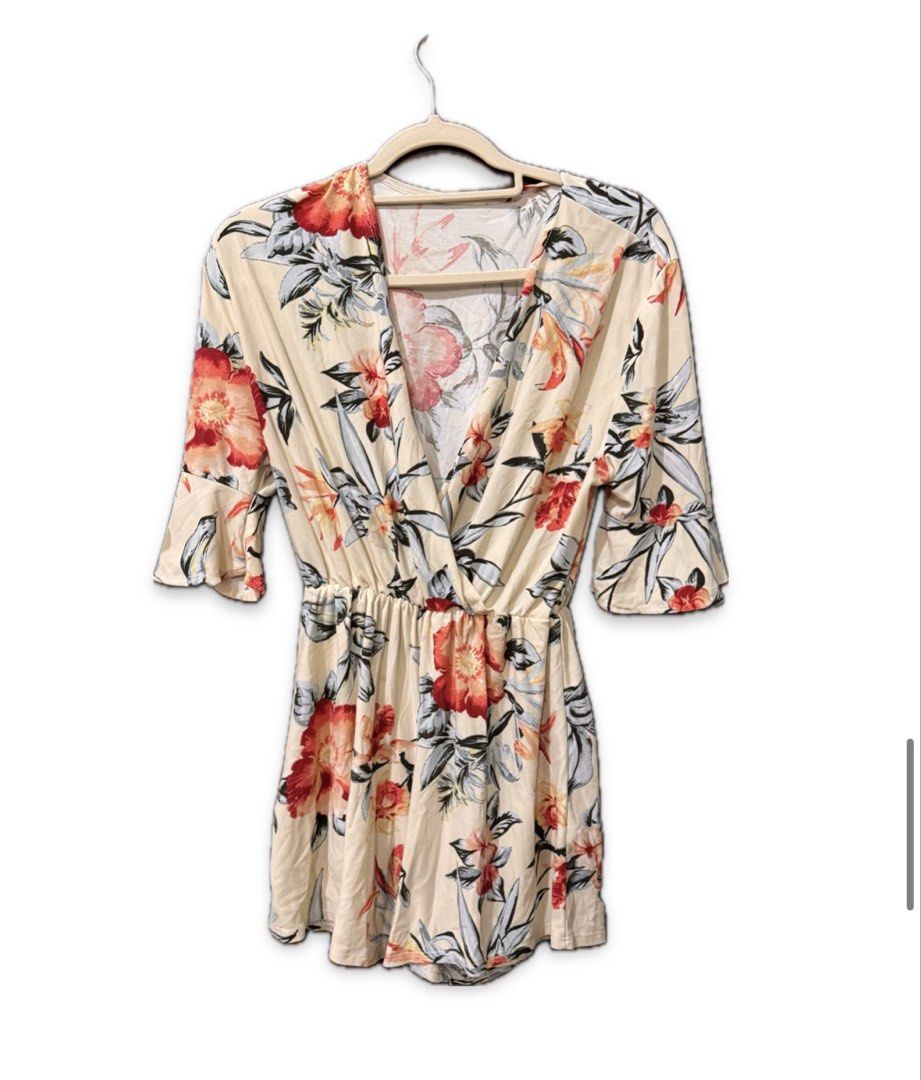 Floral Print Romper with Ruffle Sleeves (Category: Rompers) located in Quezon City. Submitted by ianne.declutter (Listing ID 1447999729, Image 1). Description: - Cream-colored romper with a vibrant floral print - Flattering V-neckline - Cute flutter sleeves - Comfortable elasticated waist - Ideal for casual wear or beach vacations - Easy to style and wear.