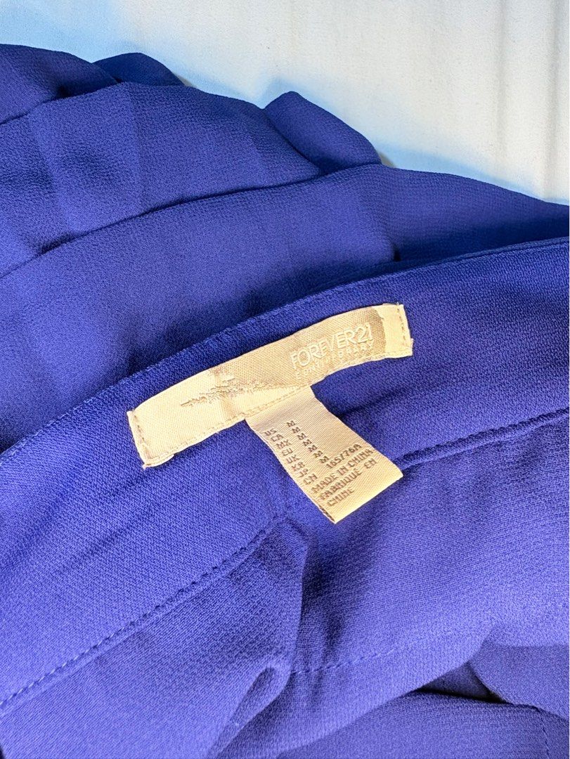 Forever 21 Blue Ruffled Layered Skirt (Category: Skirts) located in Manila. Submitted by thriftwithgem (Listing ID 1469254895, Image 2). Description: - Brand: Forever 21 - Color: Bright royal blue - Style: Tiered ruffle skirt with multiple flowy layers for great volume and movement - Waist: Mid-rise with a structured fit - Size: 165/76A M-L .
