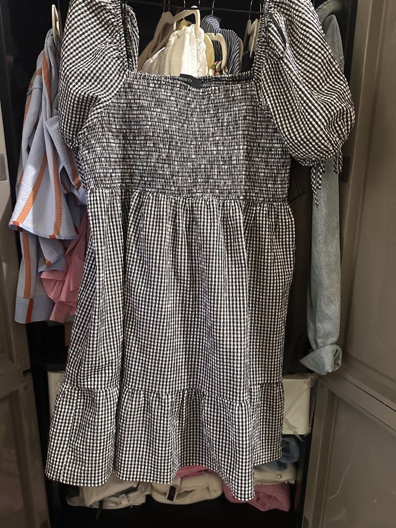 Forever 21 Plus Black White Gingham Dress 3X (Category: Dresses) located in Makati City. Submitted by adorademimay (Listing ID 1469208635, Image 1). Description: - Brand: Forever 21 Plus - Size: 3X - Pattern: Black and white gingham - Material: Super lightweight cotton (great for warm weather) - Design: Square neckline, smocked bodice, and tiered knee-length skirt - Sleeves: Puffy sleeves with cute tie details - Condition: Excellent, no flaws fou