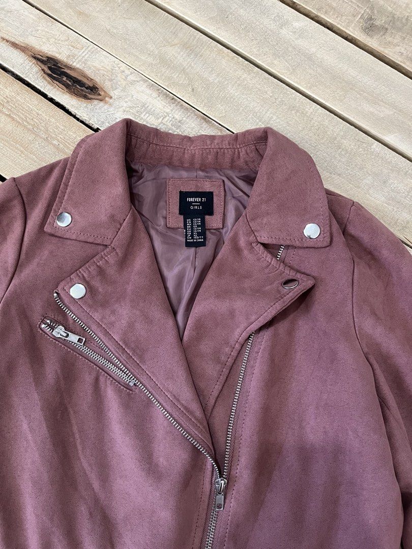 Forever 21 Suede Biker Jacket Mauve (Category: Coats, Jackets and Outerwear) located in Santa Rosa. Submitted by thrifty_bev (Listing ID 1469268147, Image 3). Description: - Brand: Forever 21 Girls - Size: 13/14 marked on tag XS Adult - Color: Mauve pink - Material: Soft faux suede with fully lined interior - Details: Asymmetric front zip, lapel collar with snap buttons, zippered chest pocket, and adjustable buckled belt at the hem - Condition: E