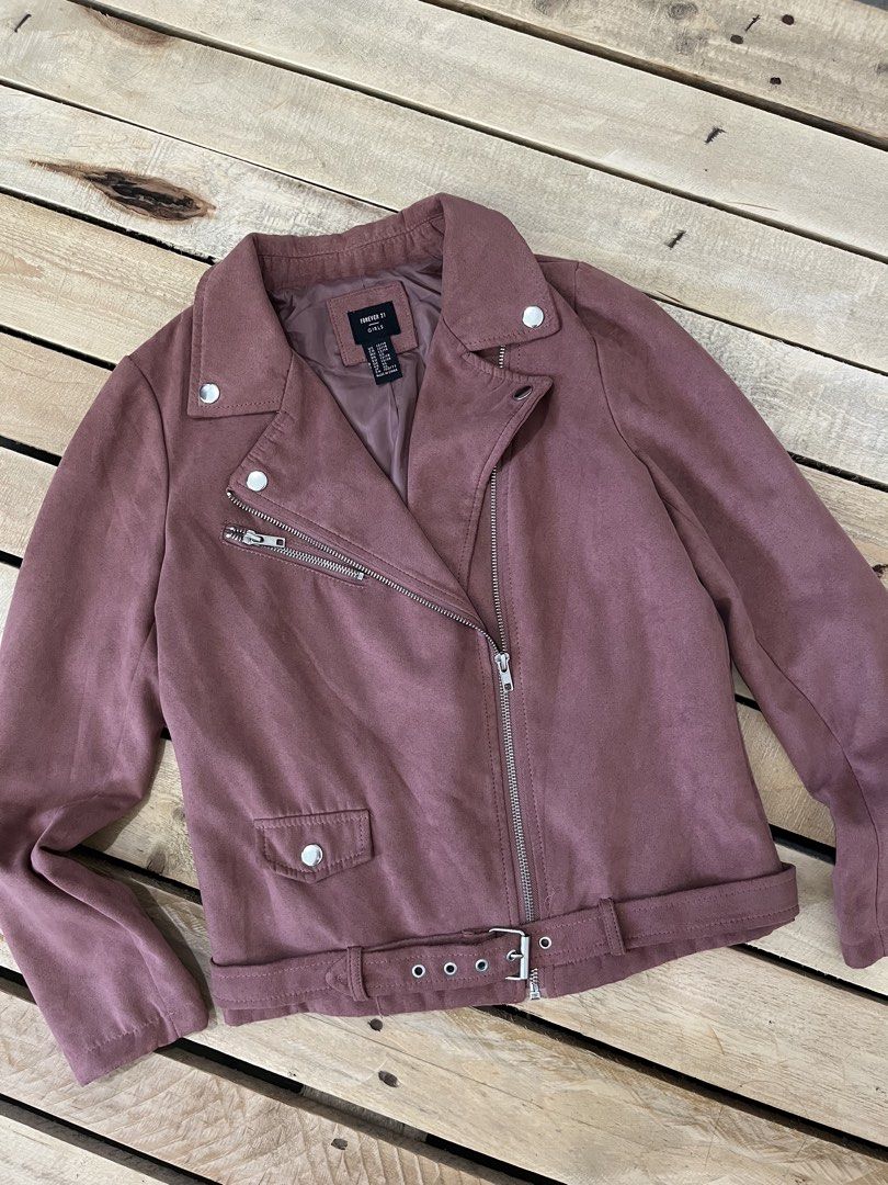 Forever 21 Suede Biker Jacket Mauve (Category: Coats, Jackets and Outerwear) located in Santa Rosa. Submitted by thrifty_bev (Listing ID 1469268147, Image 2). Description: - Brand: Forever 21 Girls - Size: 13/14 marked on tag XS Adult - Color: Mauve pink - Material: Soft faux suede with fully lined interior - Details: Asymmetric front zip, lapel collar with snap buttons, zippered chest pocket, and adjustable buckled belt at the hem - Condition: E