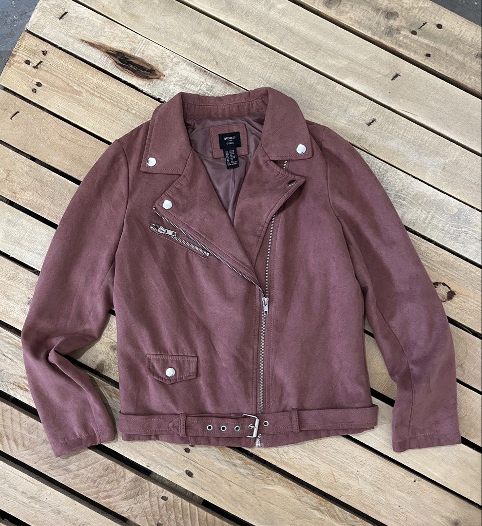 Forever 21 Suede Biker Jacket Mauve (Category: Coats, Jackets and Outerwear) located in Santa Rosa. Submitted by thrifty_bev (Listing ID 1469268147, Image 1). Description: - Brand: Forever 21 Girls - Size: 13/14 marked on tag XS Adult - Color: Mauve pink - Material: Soft faux suede with fully lined interior - Details: Asymmetric front zip, lapel collar with snap buttons, zippered chest pocket, and adjustable buckled belt at the hem - Condition: E