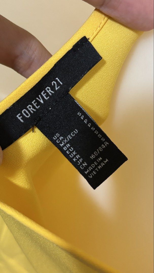 Forever 21 Yellow Spaghetti Strap Tie Front Dress (Category: Dresses) located in Santa Cruz. Submitted by zellethrifts (Listing ID 1469300106, Image 3). Description: • Bought in Forever21 Japan 🇯🇵 • Used / Like new • Fits small to medium • In excellent condition • Photos taken using mannequin only 🚚 Shipping via J&T only 📦 Shipping fee to be shouldered by buyer 💳 Mode of payment: GCash 📍 Santa Cruz, Laguna.