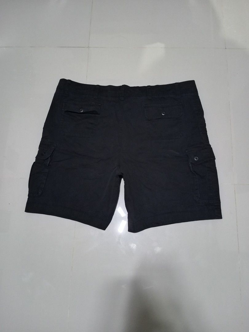 Foundry Stretchable Flex Cargo Shorts Size 50 Black (Category: Shorts) located in Magdalena. Submitted by magdalenathrift20 (Listing ID 1469168750, Image 3). Description: - Brand/Model: Foundry Stretchable Flex Cargo Shorts - Color: Black - Size: 50 (Waistline: 48 to 54 inches, Length: 22 inches) - Material: 98% Cotton, 2% Spandex for added comfort and stretch - Pockets: Multiple utility pockets with secure button flaps on sides and back - Style:
