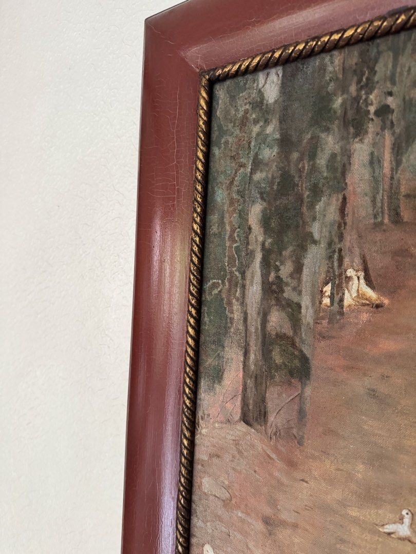 Framed Countryside Ducks Canvas Artwork – 82 × 65 cm (Category: Frames & Pictures) located in Makati City. Submitted by avic_c (Listing ID 1469186475, Image 3). Description: Charming countryside artwork depicting a flock of white ducks along a peaceful tree-lined path, in warm earthy tones. Presented in a substantial burgundy-colored decorative frame with elegant gold rope-style inner trim. The frame has a beautifully aged appearance, with fine c